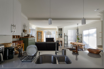 Modern white kitchen and living room. Interior design.