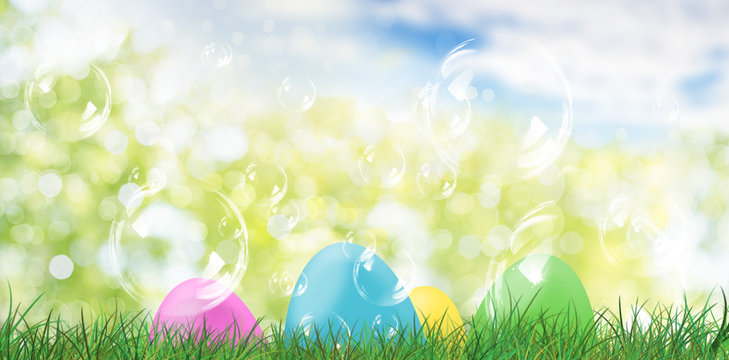 Easter eggs on green grasland meadow