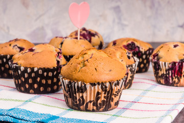 Homemade muffins on a rustic table closeup