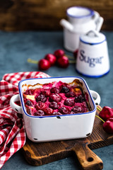 Cherry casserole with fresh berries, cheesecake