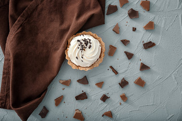 Composition with tasty tartlet on textured background, top view