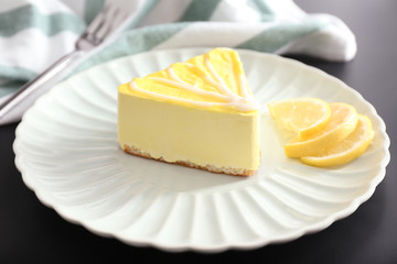 Plate with tasty souffle cake on table