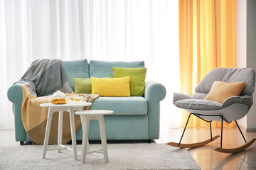 Living room interior with comfortable couch and soft pillows