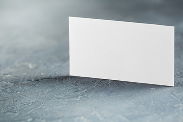 White Blank business card on concrete background. Place for ID