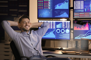 Young stock exchange trader resting in office