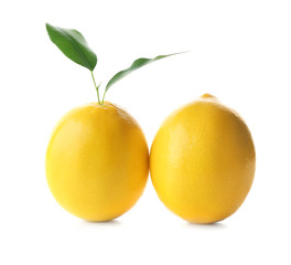 Fresh ripe lemons with leaves on white background