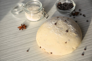 Raw dough with chocolate chips on table