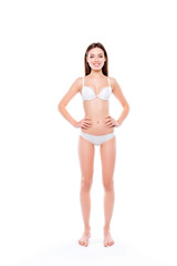 Naklejka premium Freshness youth sensual sensitive sportive clean clear purity vertical full-length portrait of stunning beautiful sporty girl keeping hands on waist line standing straight isolated on white background