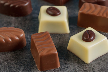 Assortment of chocolate candies sweets on a dark background