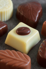 Assortment of chocolate candies sweets on a dark background
