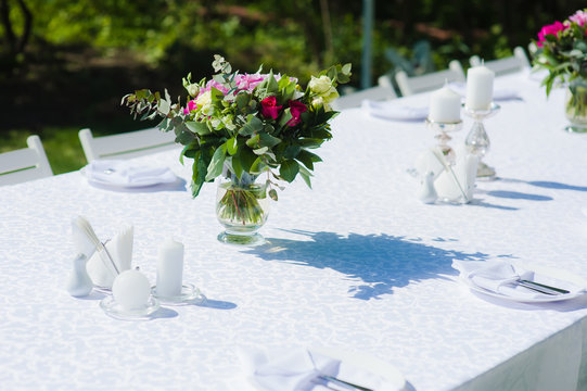 Bouquet On Table With White Tablecloth In Nature