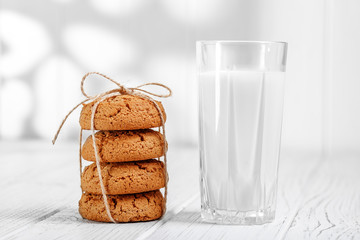 A glass of milk and delicious oatmeal cookies for breakfast. The
