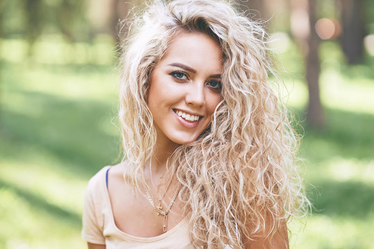beautiful curly blonde smiling