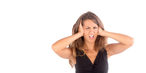 Beautiful girl with her hands covering her ears; isolated photo with copy space
