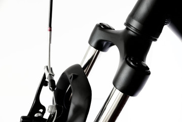Front suspension of bicycle isolated on white, unusual angle