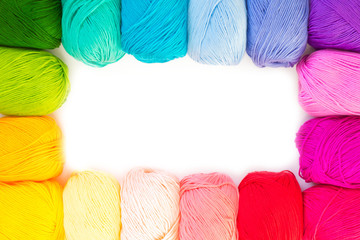 Colored balls of yarn. View from above. Rainbow colors. All colors. Yarn for knitting. Skeins of...
