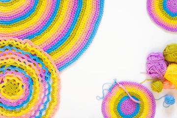 Color striped crocheted crochets. White background.