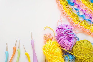Color striped crocheted crochets. White background.