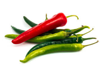 Green chili pepper and red pepper isolated on black background cutout