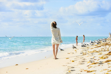 Miami Beach, peaple are walking. Located in Miami, Florida, USA.