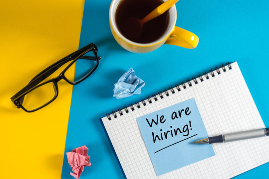 WE'RE HIRING CONCEPT at Human Resources Manager workplace. Job recruiting advertisement