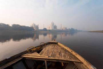 Epic Sunrise at Taj Mahal from the river in a boat 
