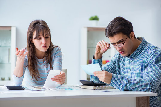 Young Couple Looking At Family Finance Papers