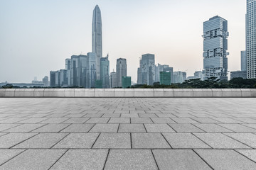 Panoramic skyline and buildings with empty square floor.