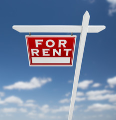 Left Facing For Rent Real Estate Sign on a Blue Sky with Clouds.