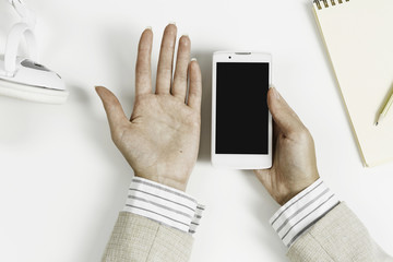 Businesswoman using her smartphone