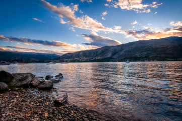 Sunset at Wanaka lake-front from Eely Point. Wanaka is a popular ski and summer resort town in the Southern Island of New Zealand.