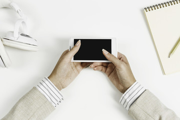 Businesswoman using her smartphone