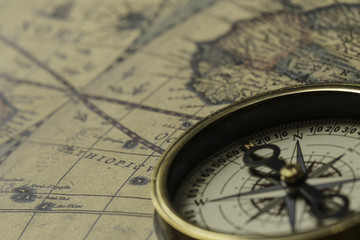 Retro compass with old map