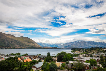 View of Wanaka lake and alpine resort town with  the mountain range in the background from the Wanaka War Memorial.