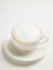 Cup of coffee on the rustic wooden background. Selective focus. Shallow depth of field.
