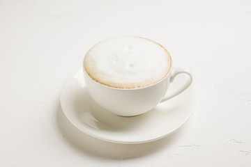 Cup of coffee on the rustic wooden background. Selective focus. Shallow depth of field.