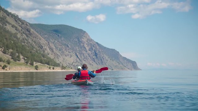 ProRes. Mеn kayaking on Lake Baikal. Travel.