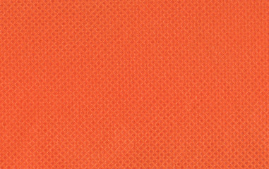 Orange texture. Geometric stamped pattern . Warm, joyful color. The canvas is filled with rhombuses...
