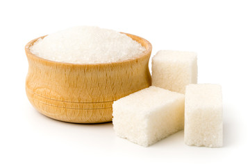 Sugar in wooden plate and cubes refined on white background.