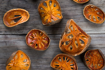 Dry Bael fruit - Slices of dry Bael fruit on the wooden table