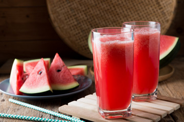 Watermelon smoothie on wood background