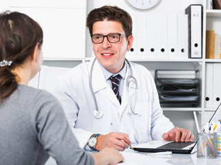 Doctor speaking with client in the medical center