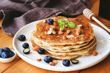 Almond pancakes with blueberries and mint leaf. Dieting, healthy eating, healthy breakfast food