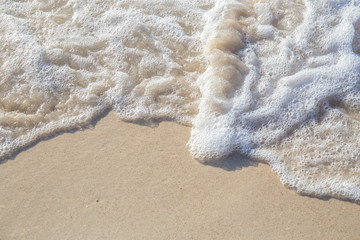 The movement of the waves on the sand is smooth and fine for  background,Soft focus