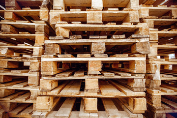 Wooden pallets stacked a warehouse