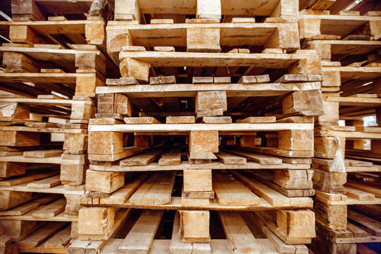 Wooden pallets stacked a warehouse