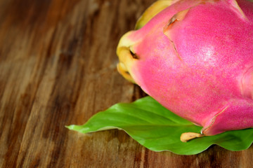 Pitaya or dragon fruit on a wooden background