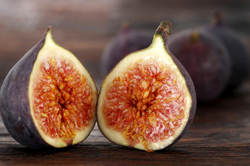 Ripe sweet figs . Healthy fig fruit on wooden table
