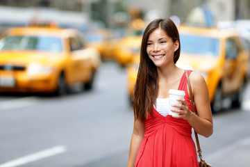 Happy Woman Holding Disposable Cup On City Street, New Yorik City, USA