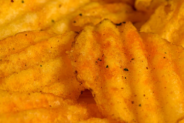 Corrugated potato chips close up. Selecetive focus.